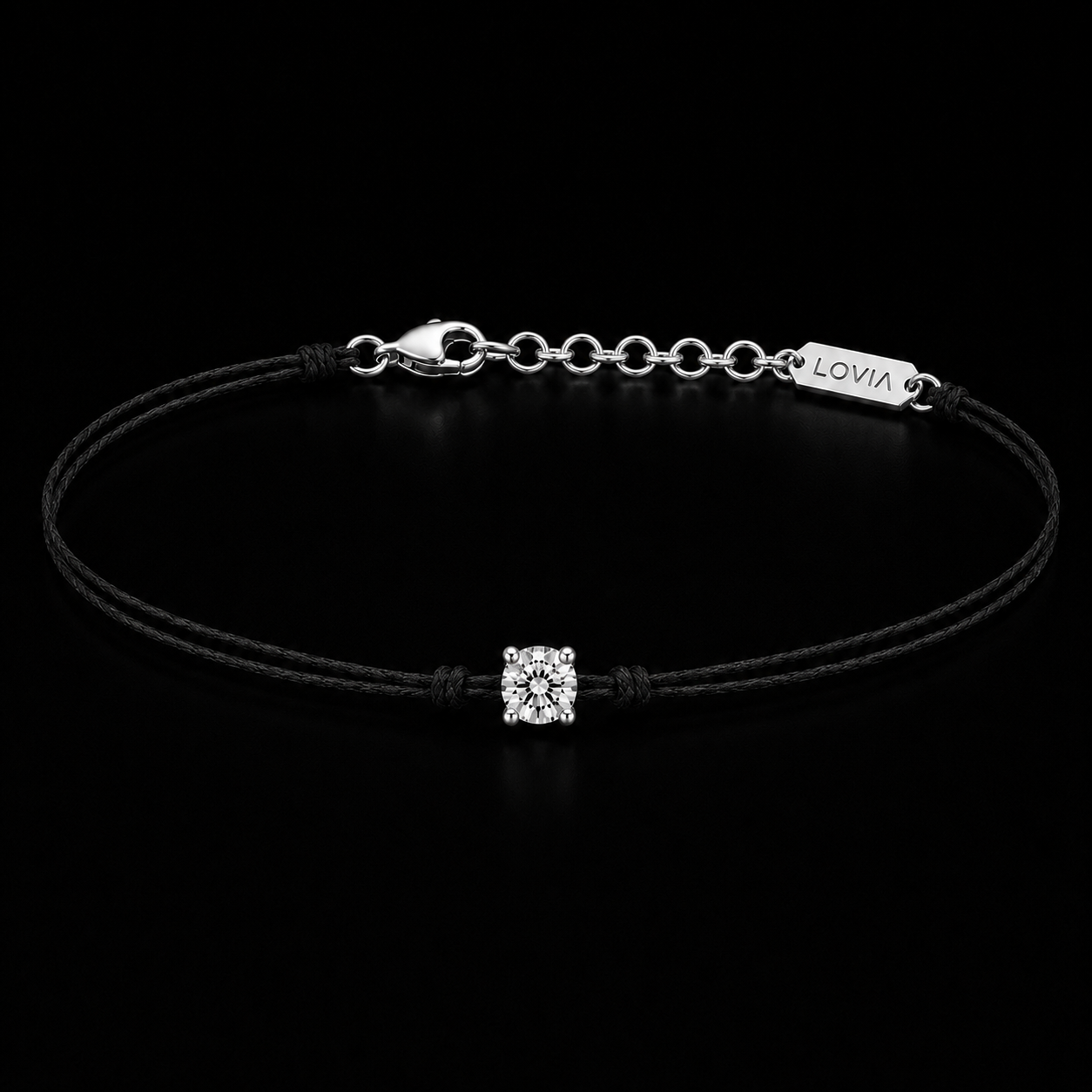 Single diamond on a black cord bracelet